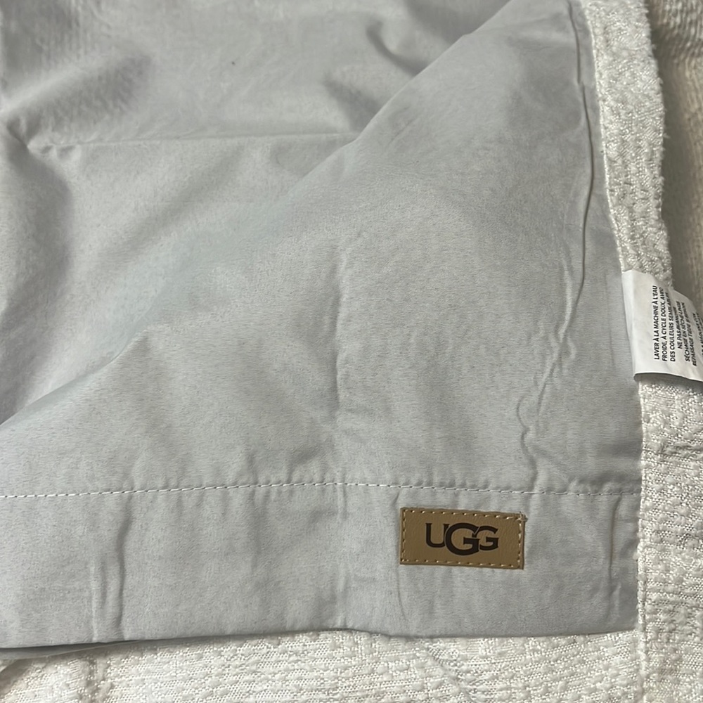 Ugg, white blackout curtain.